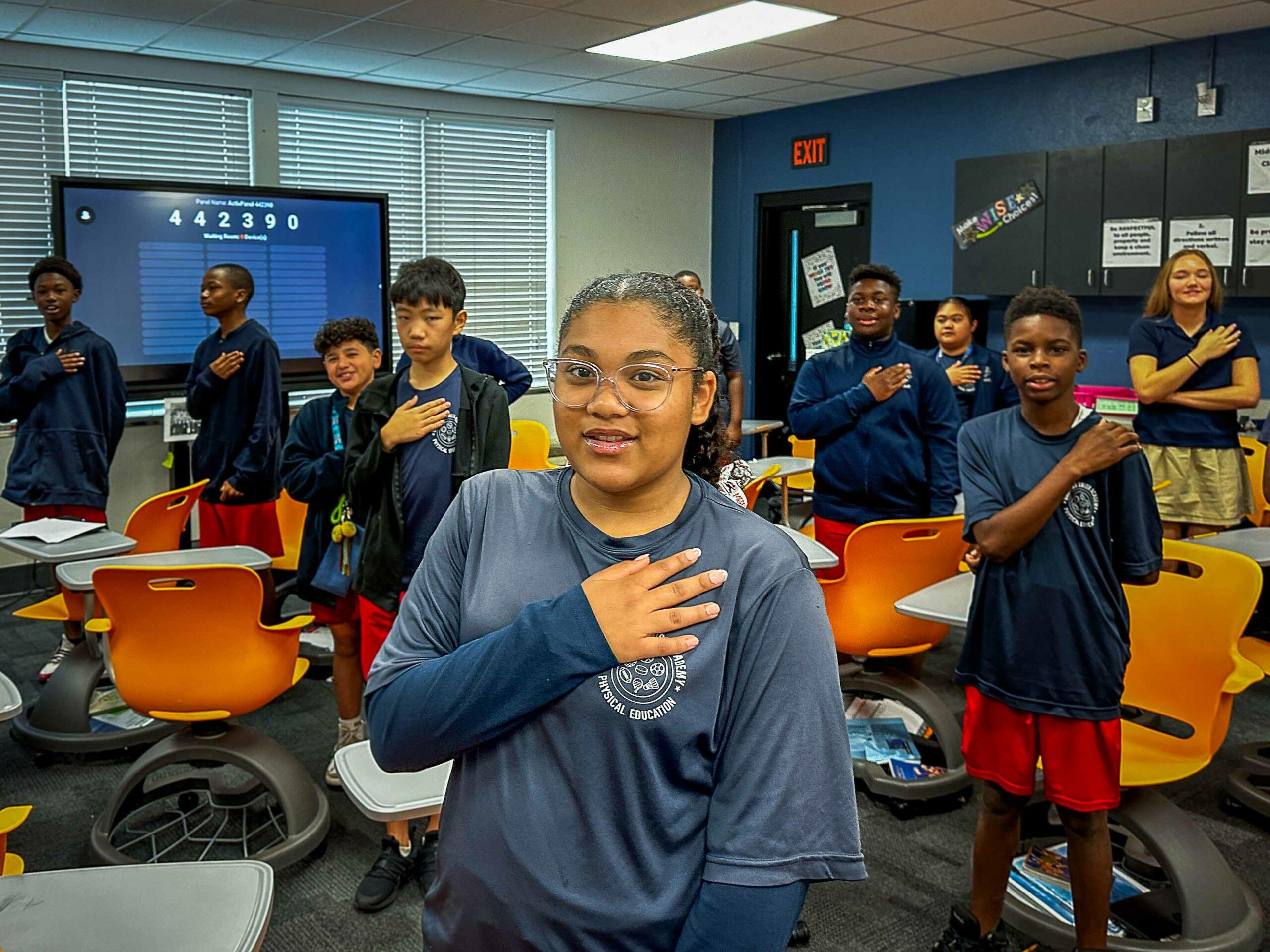 OJA students with hands over hearts at morning assembly, College Park Orlando