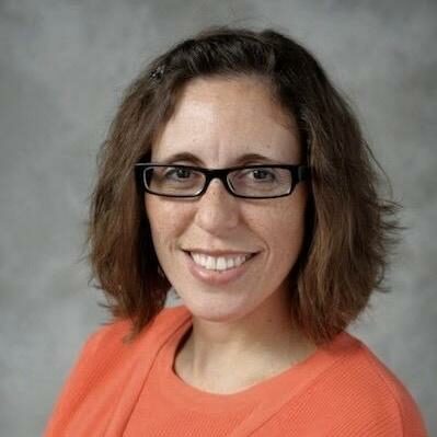 Principal Sharlene smiling at camera